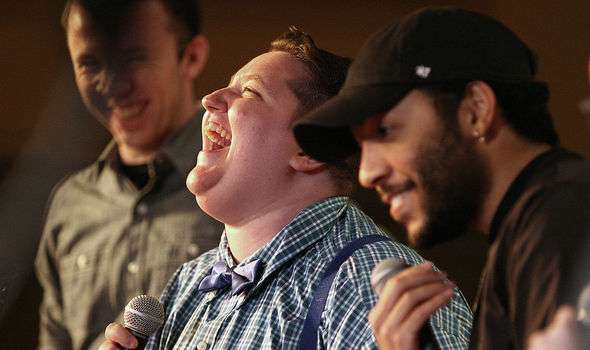 student laugh while singing